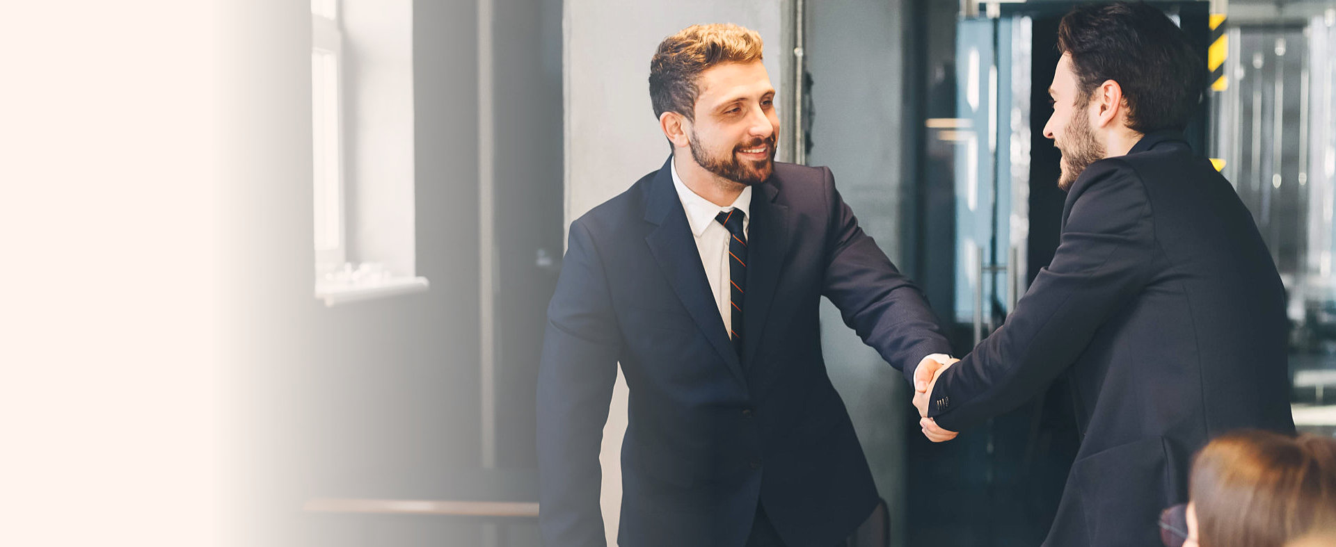office staff and a client shaking hands